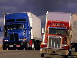 Two reefer trucks with an Indiana IRP plate, Indiana IRP license plate, Indiana Apportioned IRP license plate, Indiana IRP Apportioned license plate